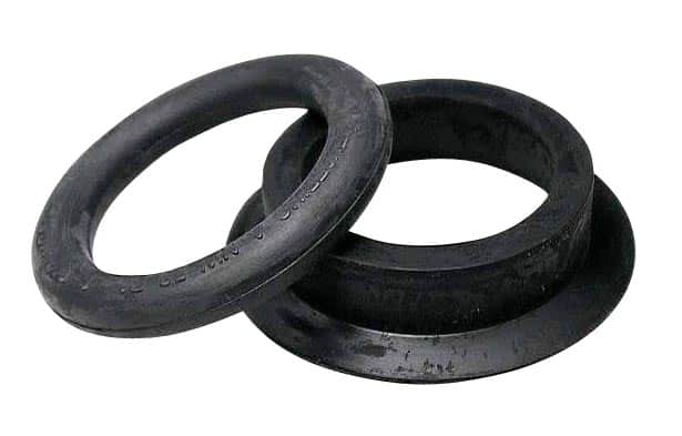 Two black rubber O-rings overlapping each other for scale or seal.