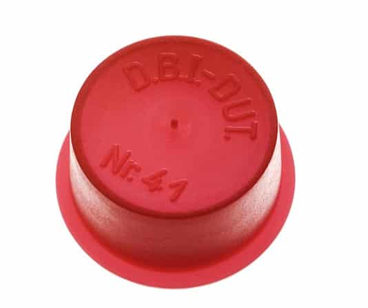 Red plastic push-button cap with embossed text 'D.B.I-DUT Nr.41' on a circular base.
