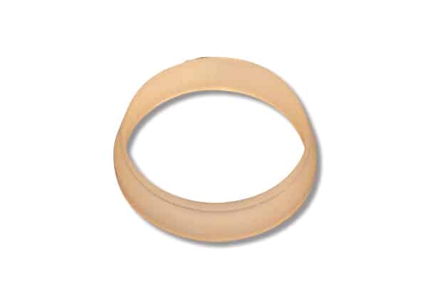 Beige circular ring with a hollow center, like a small gasket or O-ring, viewed from above