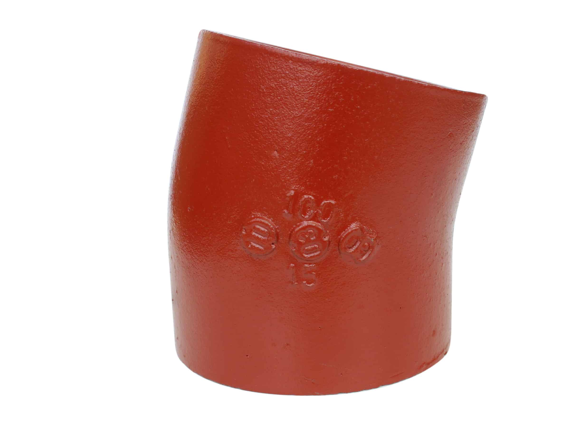 Close-up of a glossy red lipstick tube standing upright against a white background, showing the curved edge and embossed lettering partially visible on the surface.