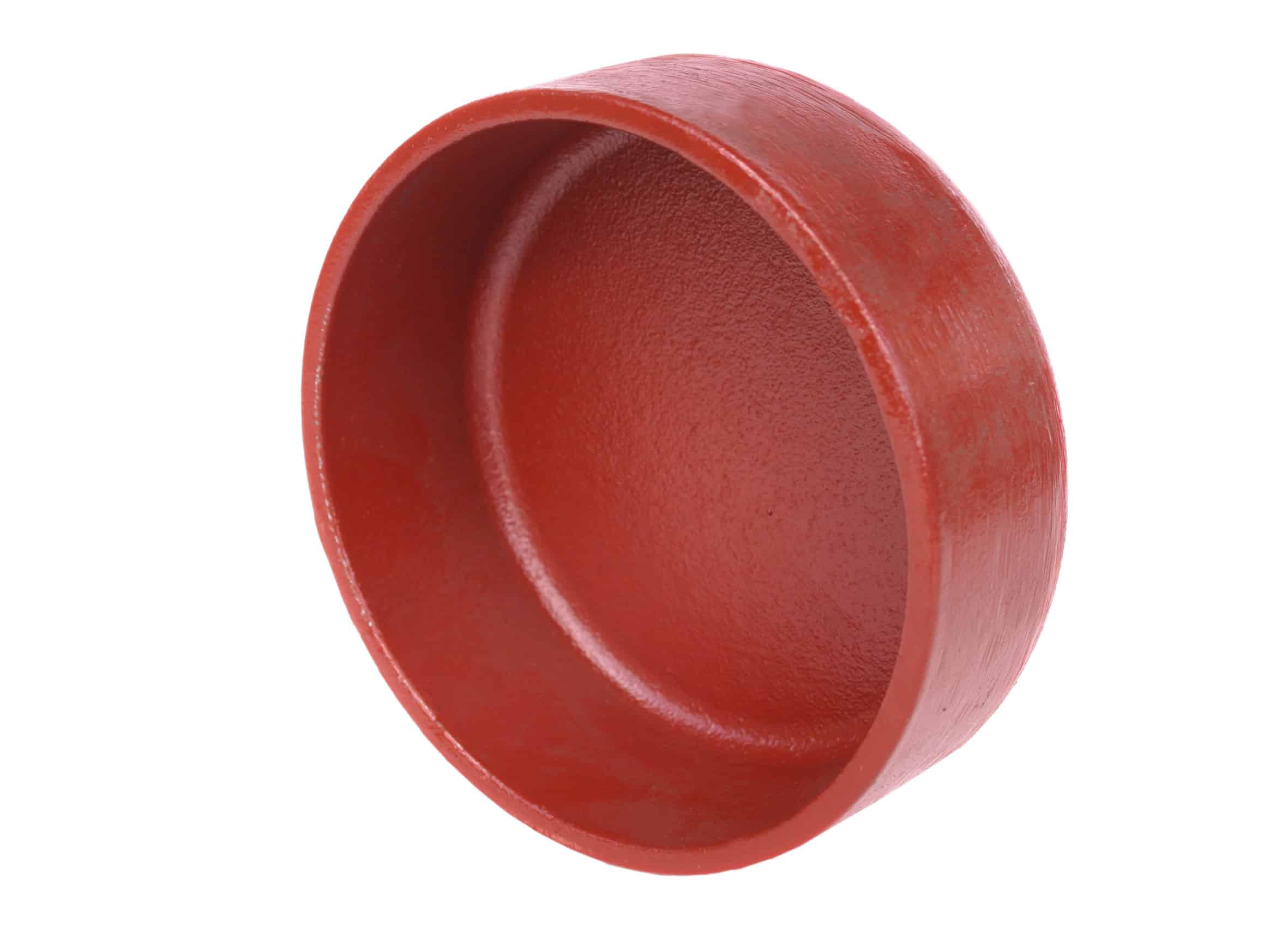 Close-up of a red circular ring-shaped object with a hollow center against a white background.
