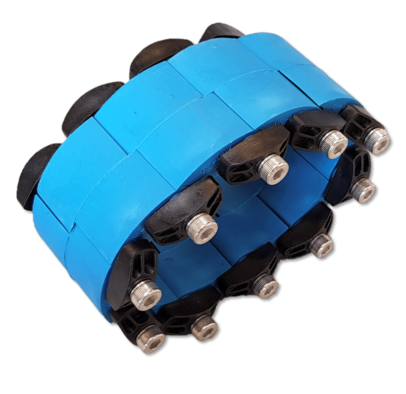 Blue modular track links connected by bolts, forming a flexible conveyor/track segment.