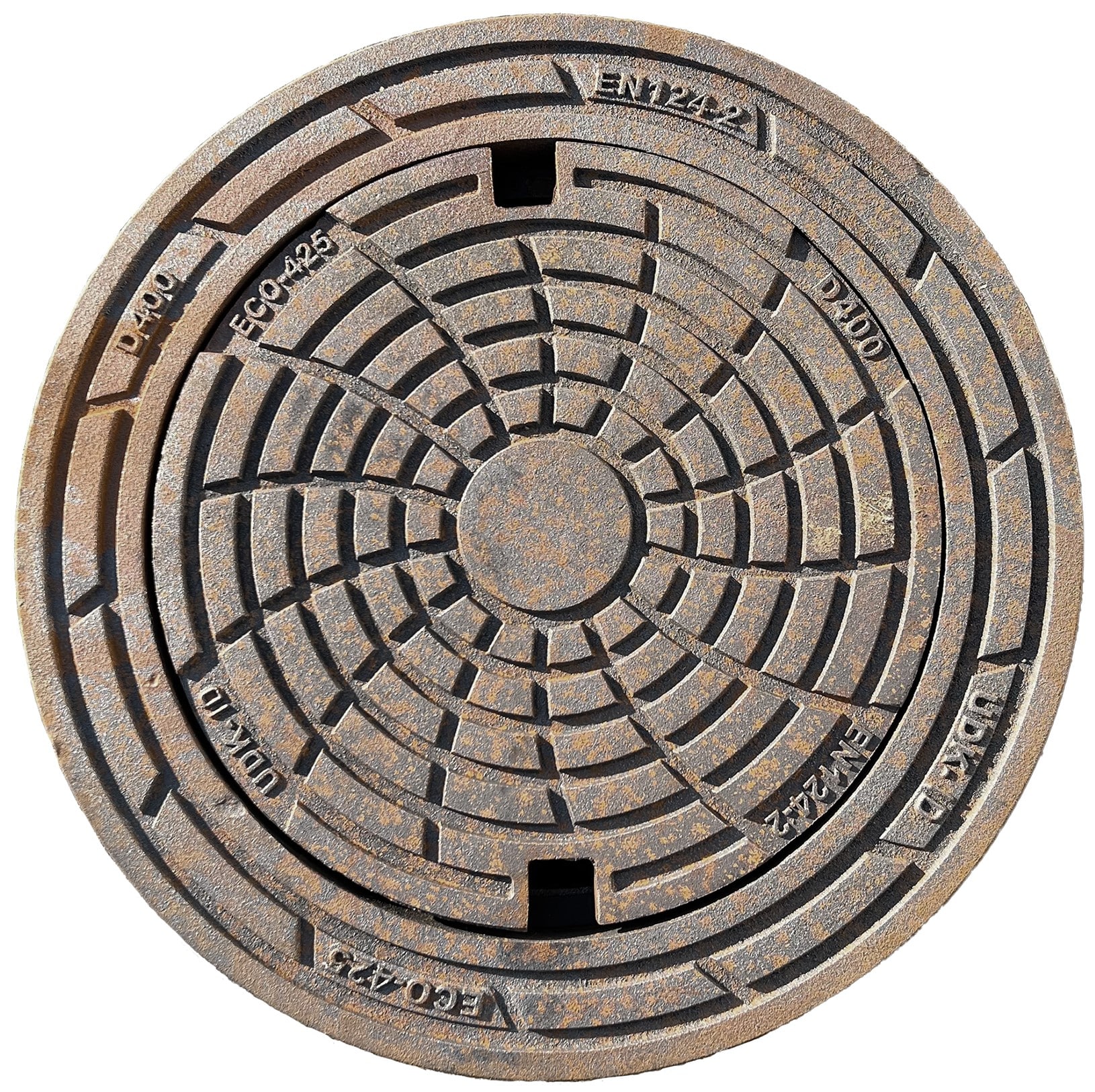 Round manhole cover with concentric rings and rust speckling; raised square opening in center.