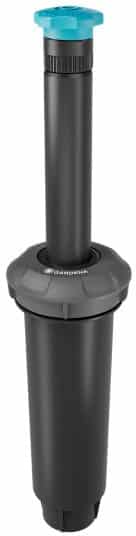 Pop-up garden sprinkler head with turquoise adjustment cap and dark gray body, used in irrigation systems.