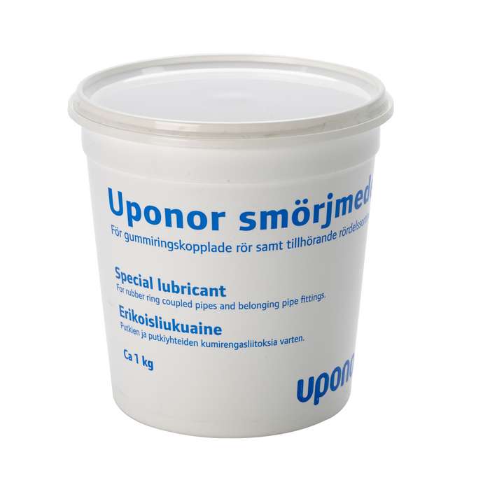 White plastic tub labeled 'Uponor smörjemedel' with blue text reading 'Special lubricant for rubber ring coupled pipes and belong pipe fittings' for pipe fittings