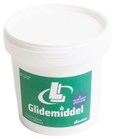 Plastic tub of lubricant with a green label reading 'Glidemiddel'.