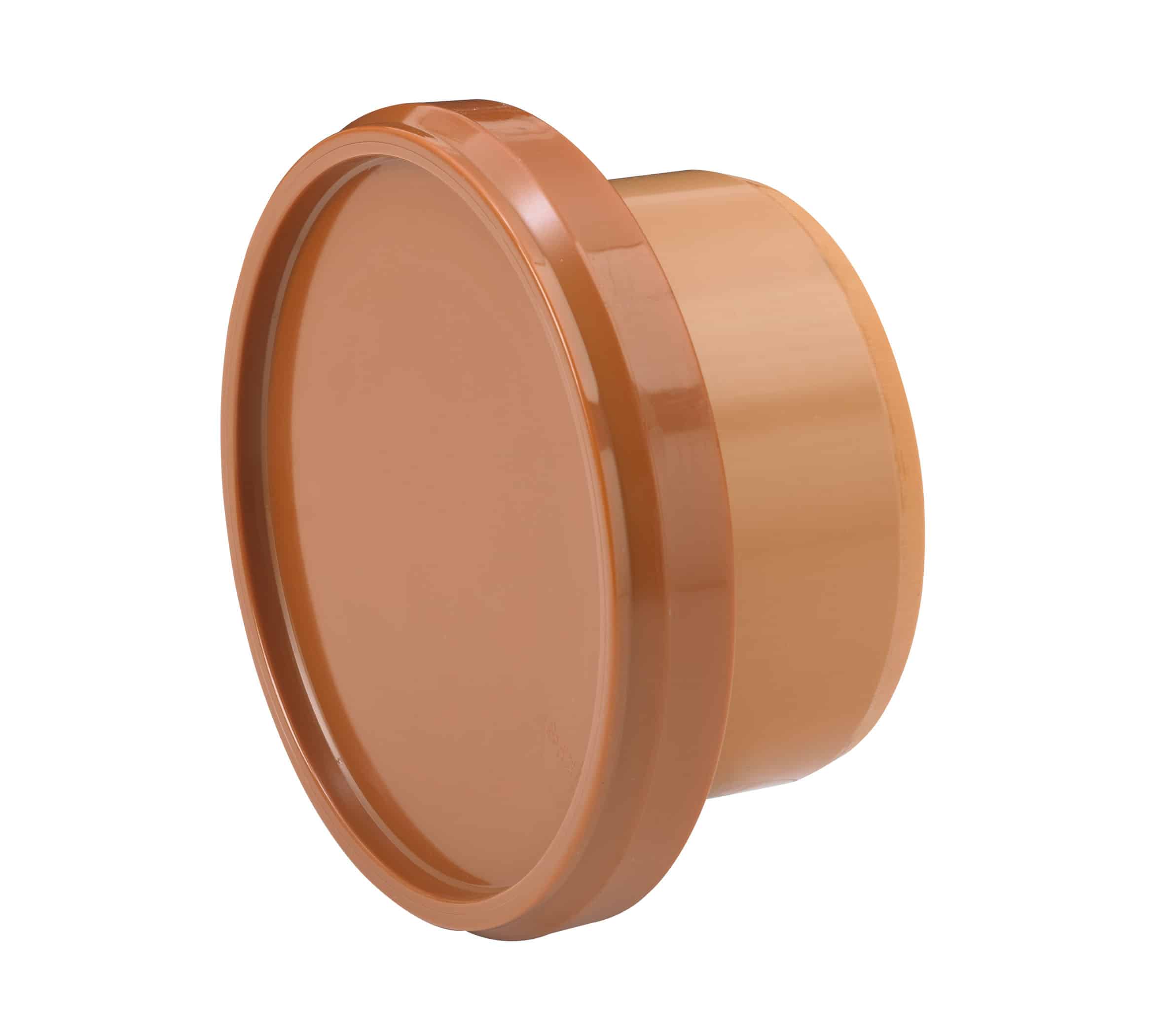 Close-up of an orange plastic cap viewed at an angle, showing glossy curved edges and a cylindrical form.