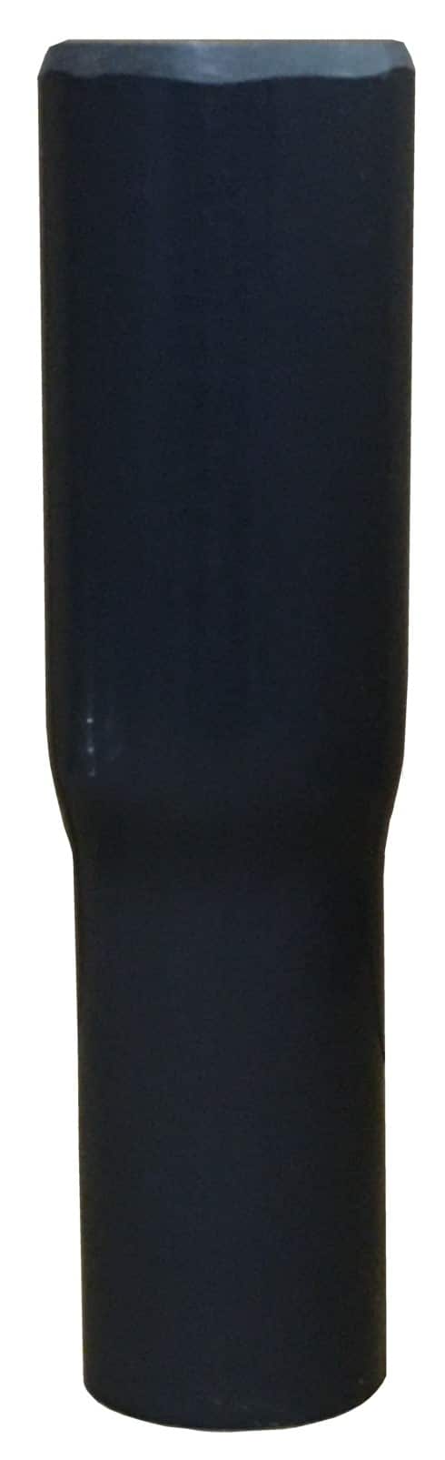 Tall black cylindrical object standing upright with flat ends, resembling a foam roller or tube