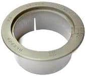 Plastic toilet flange with an outer beige mounting ring, used to seal and connect a toilet to the drain pipe.