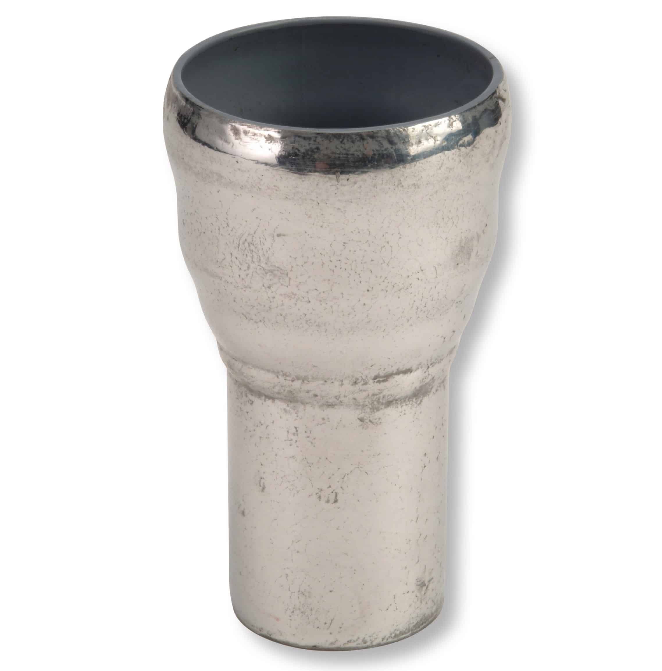Close-up of a light-colored ceramic vase with a dark grey interior and a metallic rim, showing a textured speckled surface.