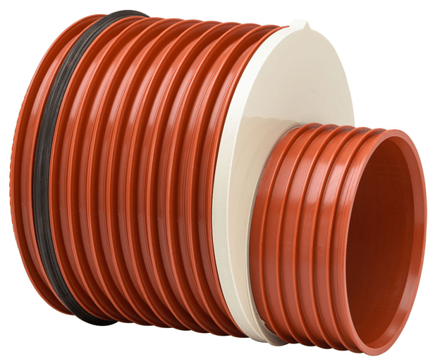 Coiled orange corrugated plastic drainage pipe on a white spool, shown in a side view.