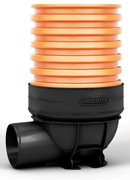 Stack of orange modular spacers atop a black drainage valve with a side outlet hose connection.