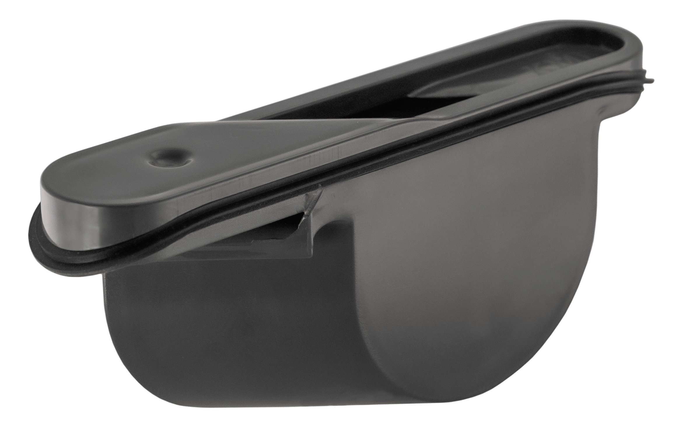 Close-up of a gray plastic desktop stapler viewed from the side with a top-loading slot visible.