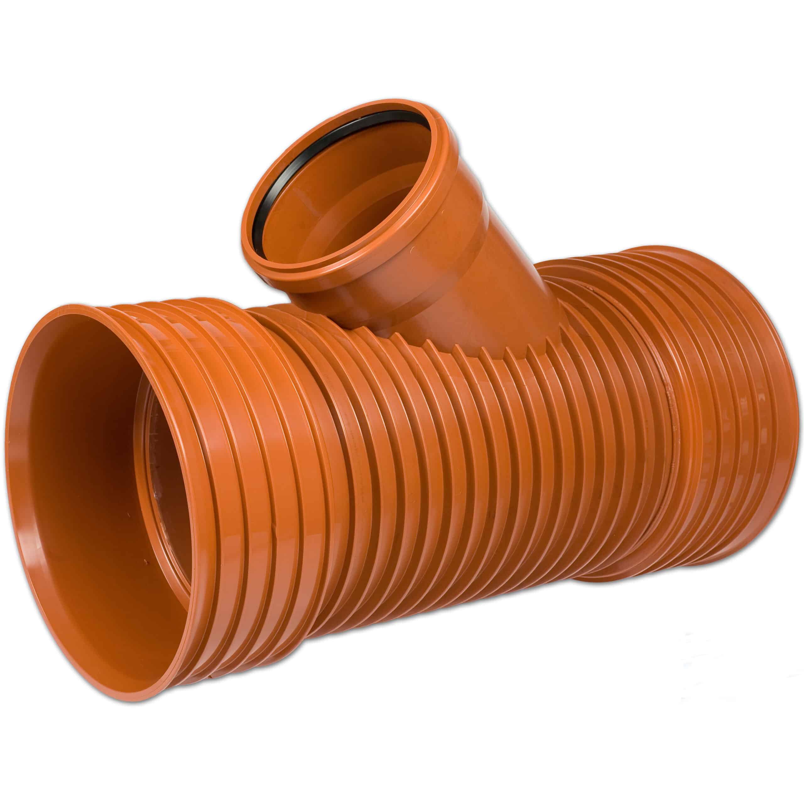 Orange corrugated plastic drainage pipe coiled together, showing ribbed texture and hollow interior