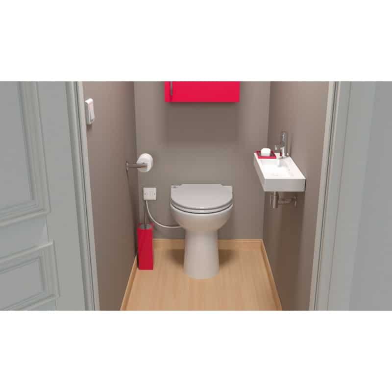 Small bathroom with a white toilet, compact wall sink to the right, gray walls, light wood floor, and red accents (bin and cabinet).