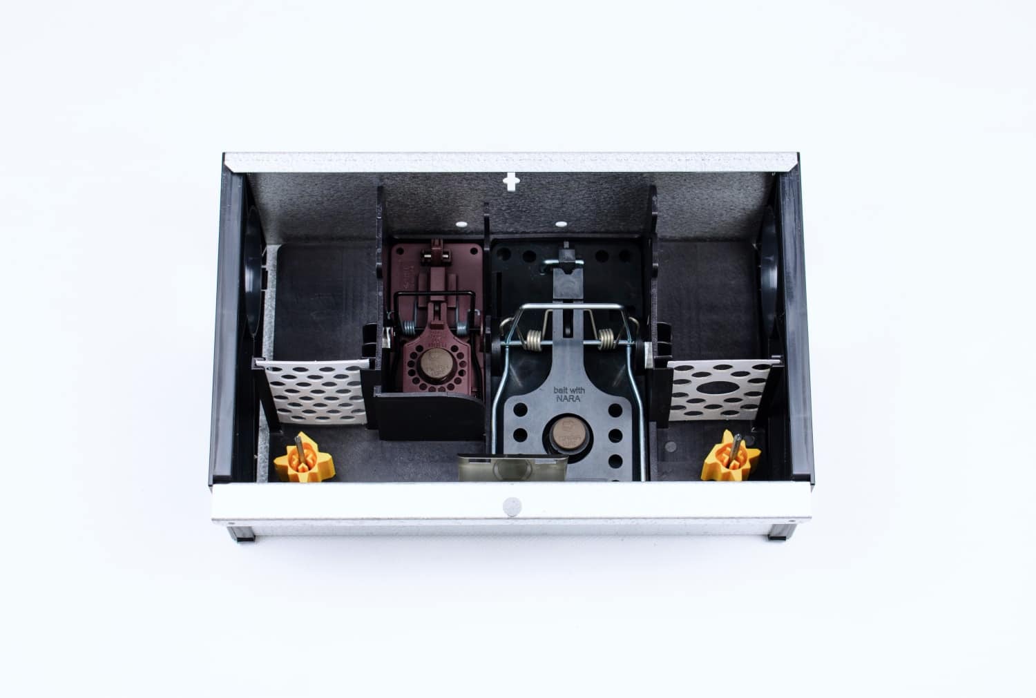 Top-down view of an open metal box containing two mechanical mousetraps with springs and levers, centered inside a dark interior.