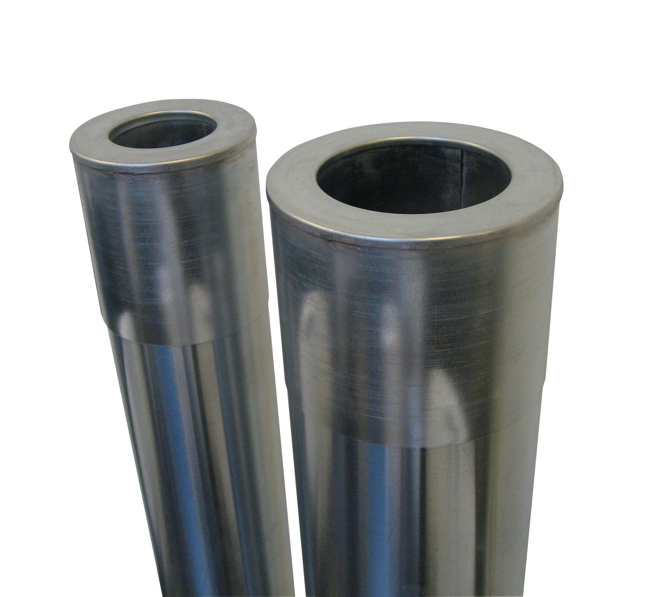 Close-up of three metallic tubes with hollow centers, standing upright against a white background