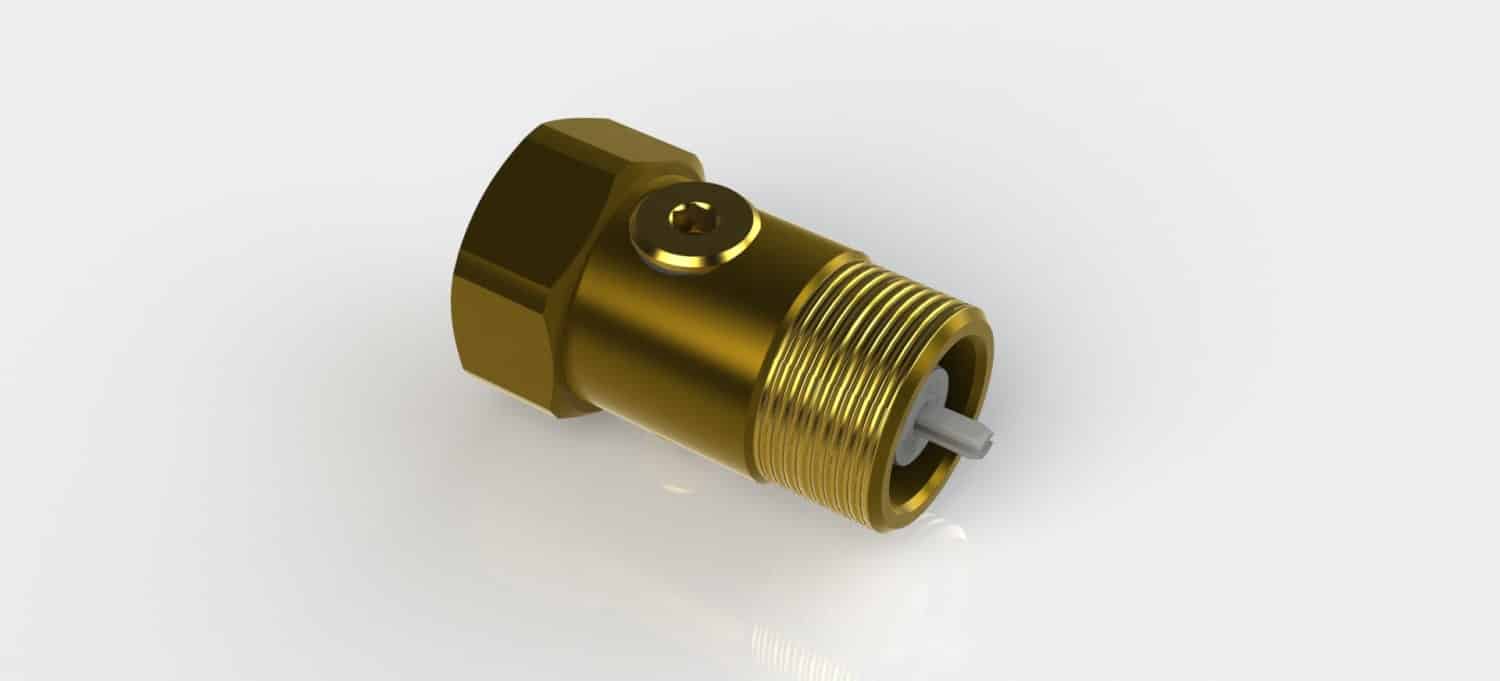 Gold-colored brass threaded fitting with a hex nut and small boss, resting on a white surface, shown at an angle.