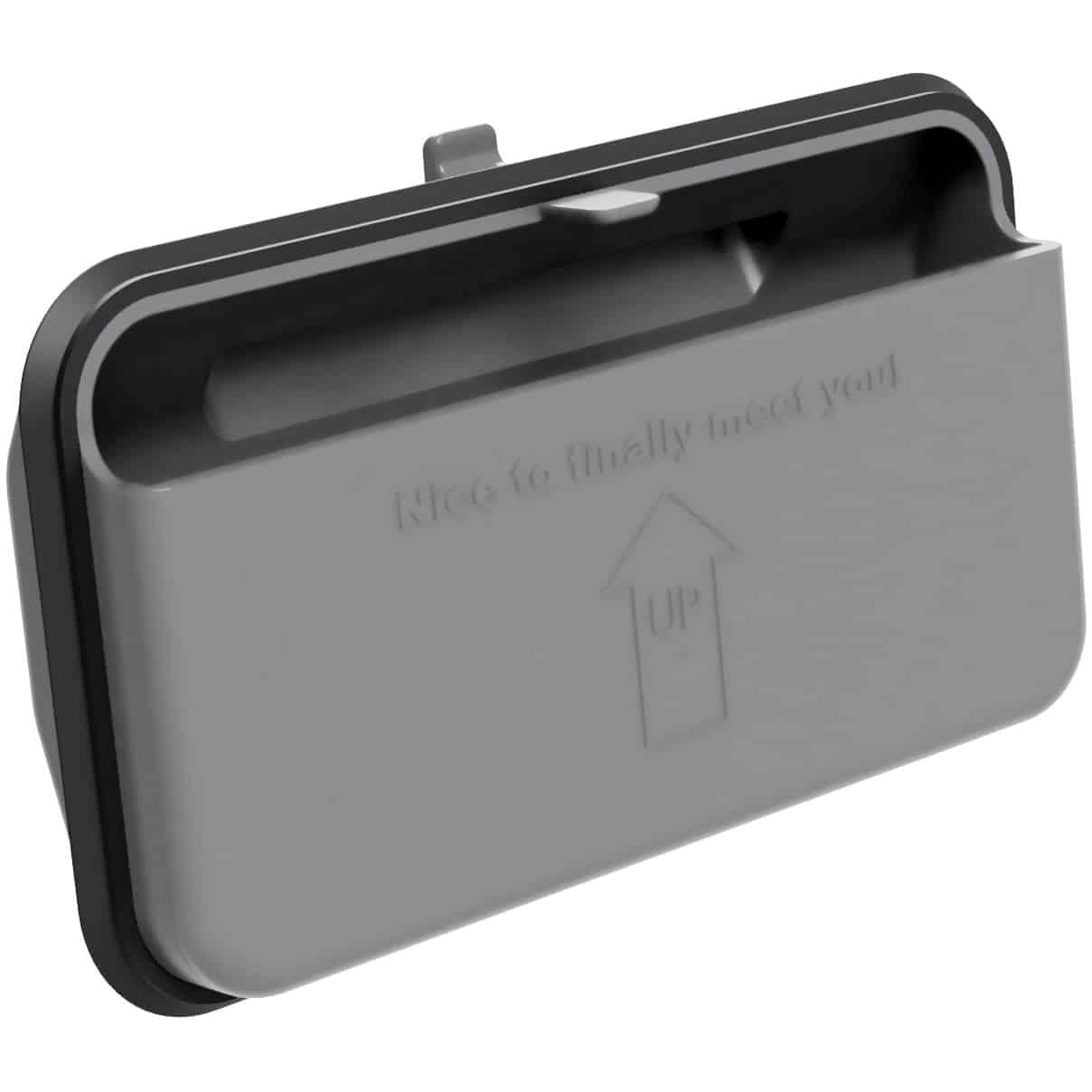 Close-up of a gray plastic cover with an embossed 'Up' arrow and text, showing a small latch or hinge mechanism.