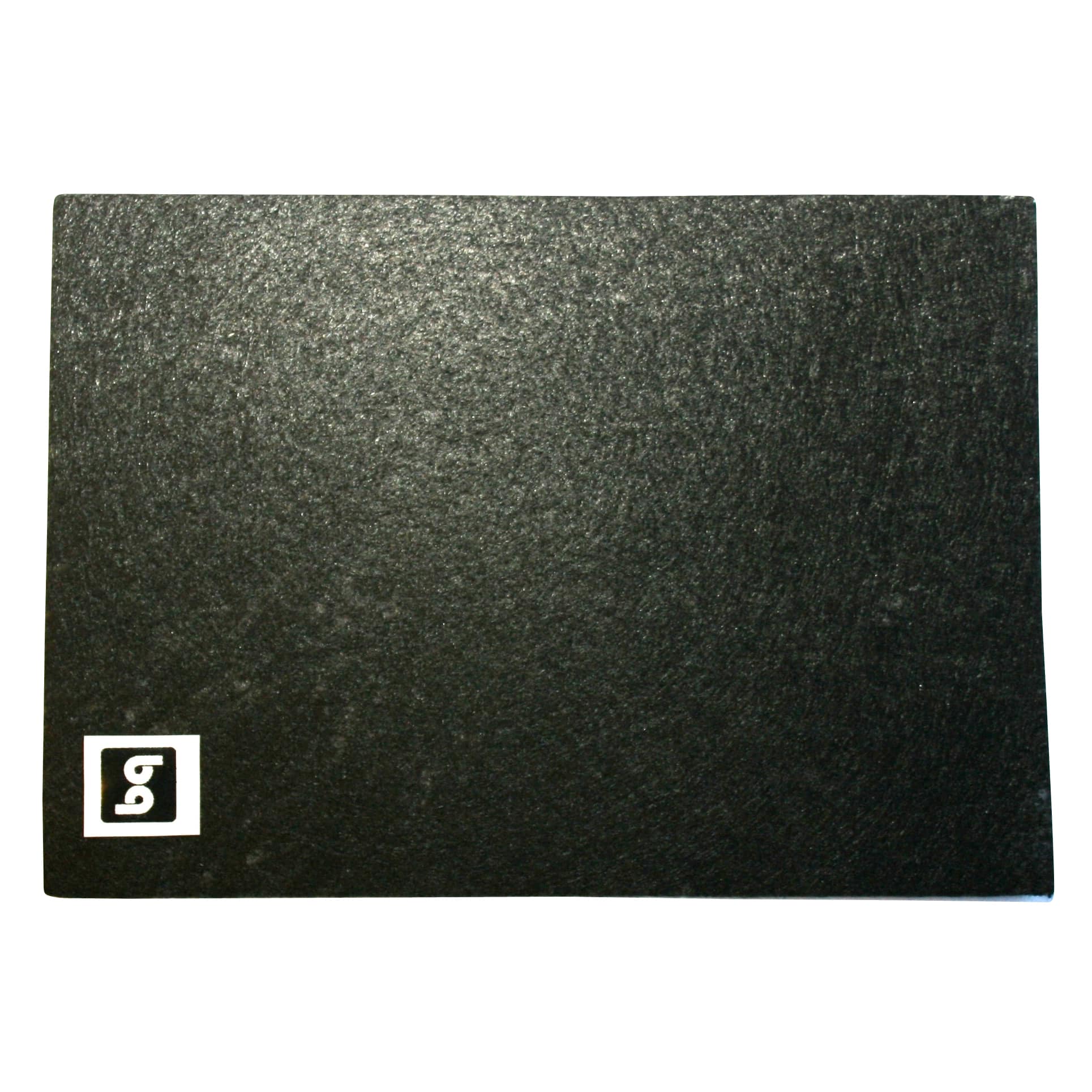 Close-up of a dark, textured surface with a white square logo in the bottom-left corner containing a stylized G.