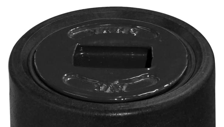 Close-up of a black bottle cap with a rectangular sip or pour spout in the center (sports bottle lid).