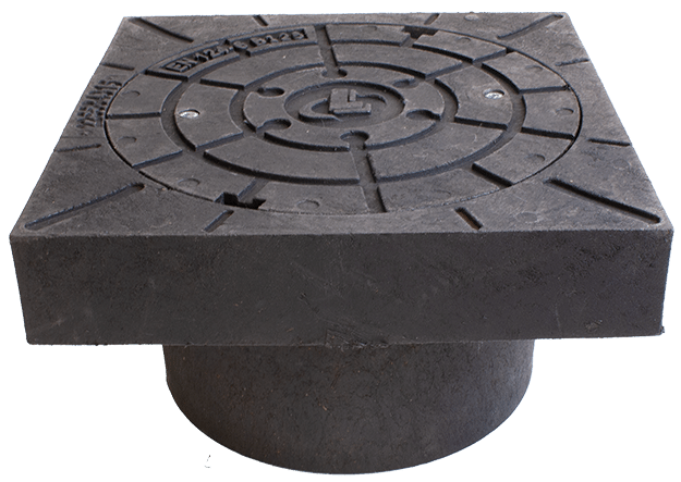 Cast iron square manhole cover with a circular base beneath, used for street access to utilities.