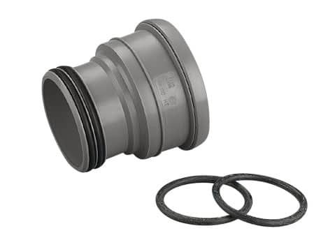Gray pipe coupling with two black rubber O-rings beside it, used to join pipes.