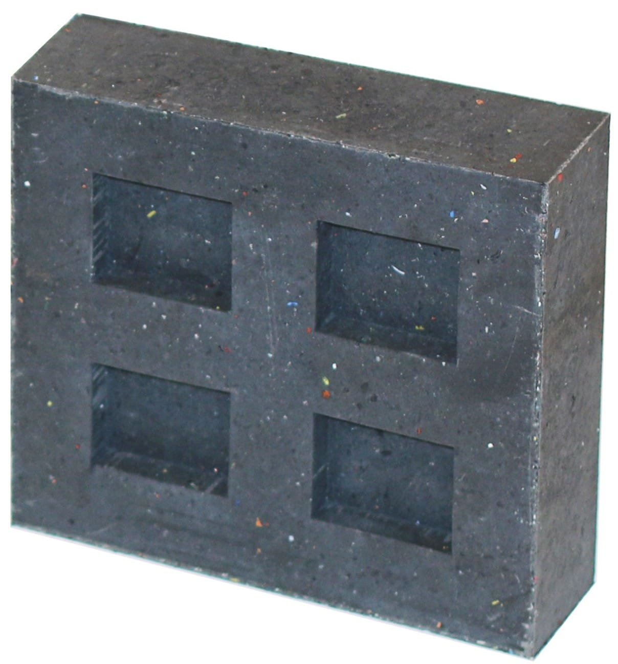 Dark speckled foam block with four square recesses arranged in a 2x2 grid on the front face.