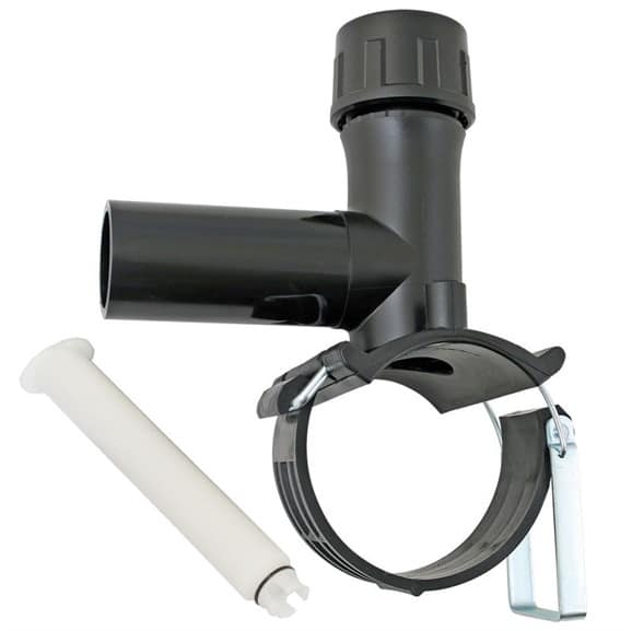 Black plastic pipe mounting bracket with a circular metal retaining strap and a white plastic connector beside it, used to secure a vertical pipe assembly.