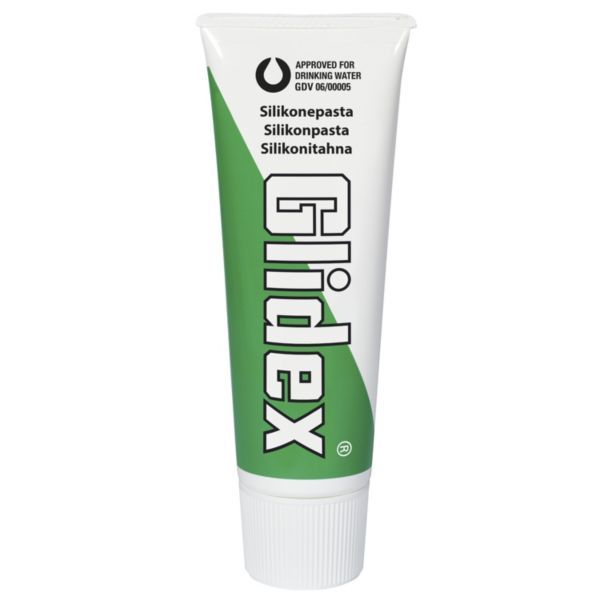 Toothpaste tube with a green diagonal stripe and the branding 'Glidex' in large letters, white cap at the bottom, with small text including 'Silikonepasta' and 'Approved for drinking water'.